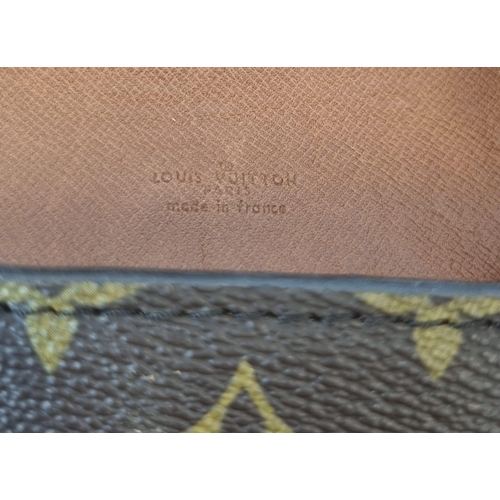 311 - A Louis Vuitton Saddle Crossbody Bag. Monogrammed brown canvas and leather exterior. Zipped interior... 