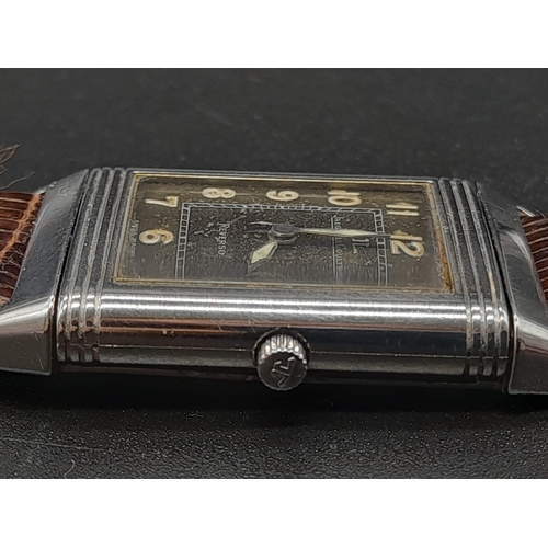 346 - A Jaeger Le Coutre Reverso Ladies Watch. Brown
Leather strap.  Stainless steel case - 36 x 23mm. Mec... 