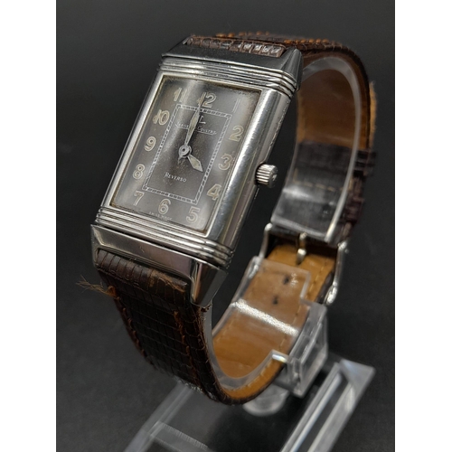 346 - A Jaeger Le Coutre Reverso Ladies Watch. Brown
Leather strap.  Stainless steel case - 36 x 23mm. Mec... 