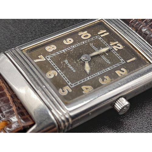 346 - A Jaeger Le Coutre Reverso Ladies Watch. Brown
Leather strap.  Stainless steel case - 36 x 23mm. Mec... 