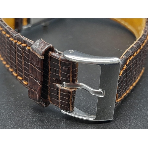 346 - A Jaeger Le Coutre Reverso Ladies Watch. Brown
Leather strap.  Stainless steel case - 36 x 23mm. Mec... 