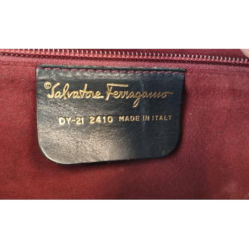 409 - An Italian Salvator Ferragamo Black Leather Bag. Red suede interior with zipped pocket. Optional sho... 