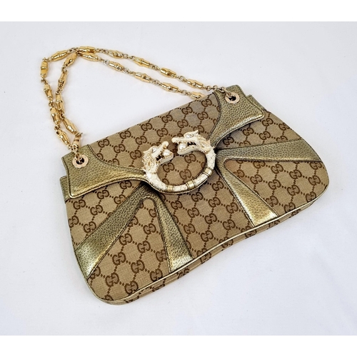 47 - A Gucci Dionysus Dragons Head Handbag. Beige monogrammed cloth with gilded touches and hardware. Twi... 