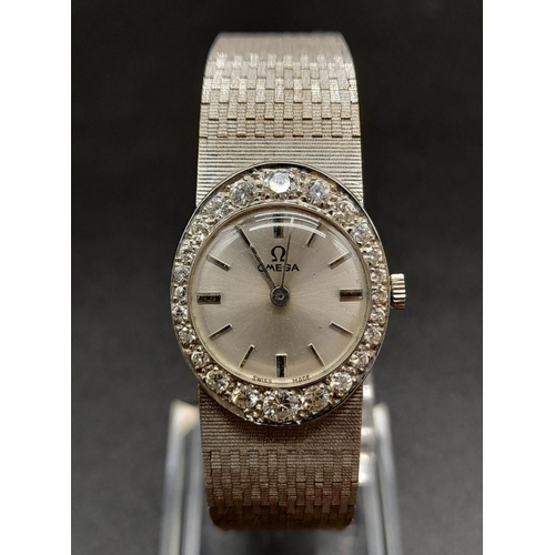 66 - An 18K White Gold and Diamond Omega Ladies Dress Watch. 18K Gold strap and case - 22mm. Silver tone ... 