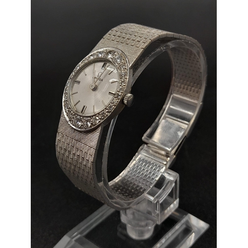 66 - An 18K White Gold and Diamond Omega Ladies Dress Watch. 18K Gold strap and case - 22mm. Silver tone ... 