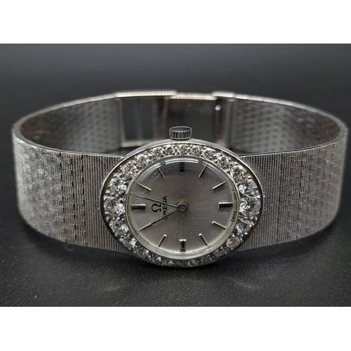 66 - An 18K White Gold and Diamond Omega Ladies Dress Watch. 18K Gold strap and case - 22mm. Silver tone ... 