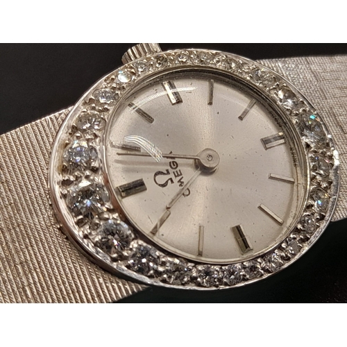 66 - An 18K White Gold and Diamond Omega Ladies Dress Watch. 18K Gold strap and case - 22mm. Silver tone ... 