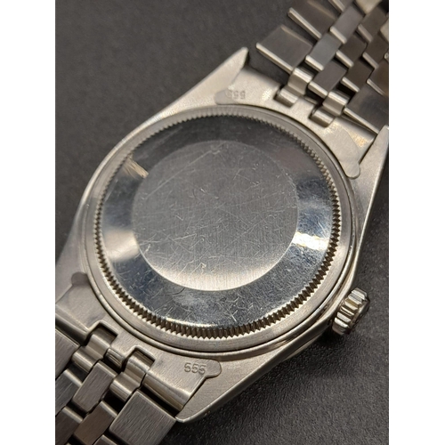 81 - A Rolex Oyster Perpetual Datejust Gents Watch. Stainless steel strap and case - 35mm. Silver tone di... 