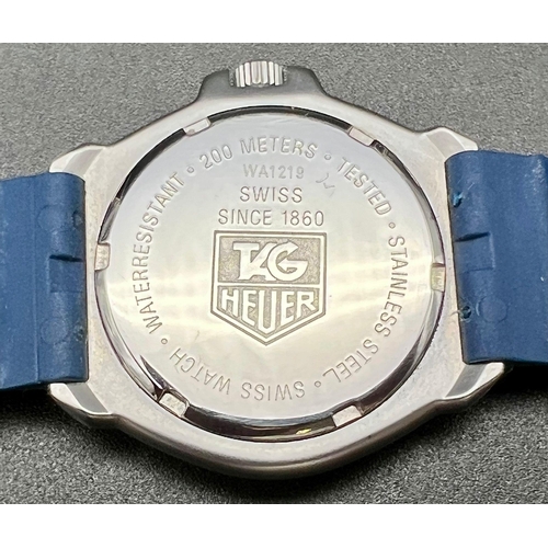 143 - A Tag Heuer Professional 200 Metres Quartz Divers Watch. Blue rubber strap. Rotating bezel. White an... 