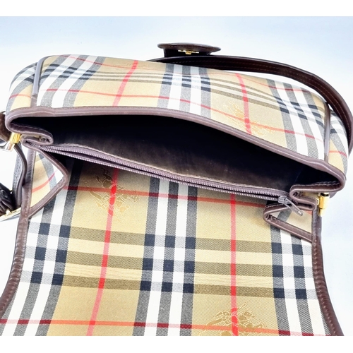 205 - A Classic Burberry London Haystack Check and Leather Crossbody Bag. Zipped interior compartment. In ... 