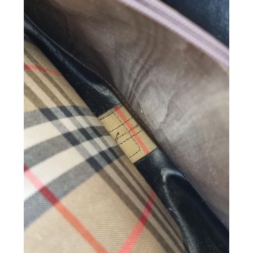 205 - A Classic Burberry London Haystack Check and Leather Crossbody Bag. Zipped interior compartment. In ... 