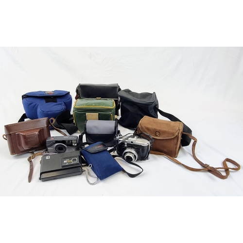 450 - A Brilliant Collection of Vintage Cameras. Including 35mm, instant, movie. Plus extra lenses and oth... 