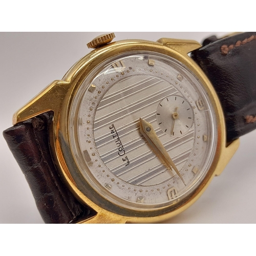 227 - A Vintage Le Coultre Gold Gents Watch. Leather strap. Gold case - 32mm. Two-tone dial with sub secon... 