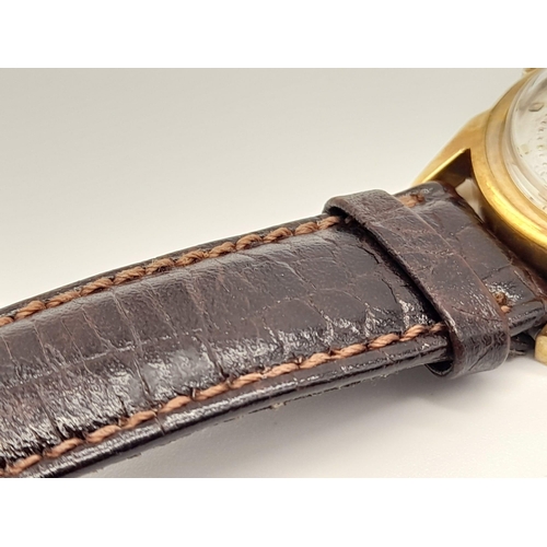 227 - A Vintage Le Coultre Gold Gents Watch. Leather strap. Gold case - 32mm. Two-tone dial with sub secon... 