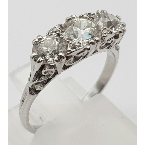 235 - An 18K White Gold Three-Stone Diamond Ring. 2ct. Size -M. 4.28g total weight.