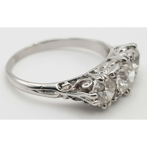 235 - An 18K White Gold Three-Stone Diamond Ring. 2ct. Size -M. 4.28g total weight.