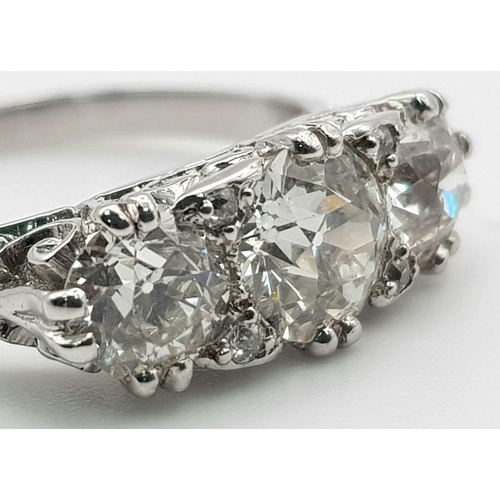 235 - An 18K White Gold Three-Stone Diamond Ring. 2ct. Size -M. 4.28g total weight.