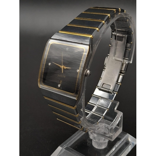 256 - A Rado Jubile Quartz Gents Watch. 18K gold and stainless steel strap. Case - 34 x 28mm. Black dial w... 