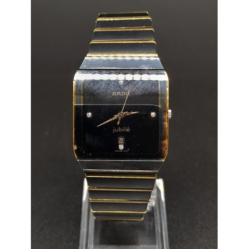 256 - A Rado Jubile Quartz Gents Watch. 18K gold and stainless steel strap. Case - 34 x 28mm. Black dial w... 