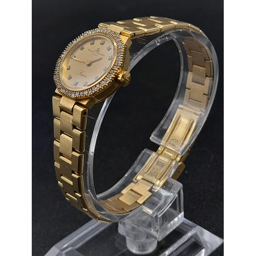 33 - A Baume and Mercier 18K Gold and Diamond Ladies Quartz Watch. 18k gold bracelet and case - 20mm. Dia... 