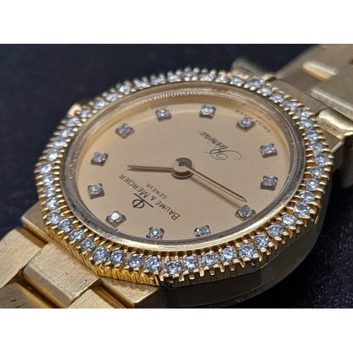 33 - A Baume and Mercier 18K Gold and Diamond Ladies Quartz Watch. 18k gold bracelet and case - 20mm. Dia... 