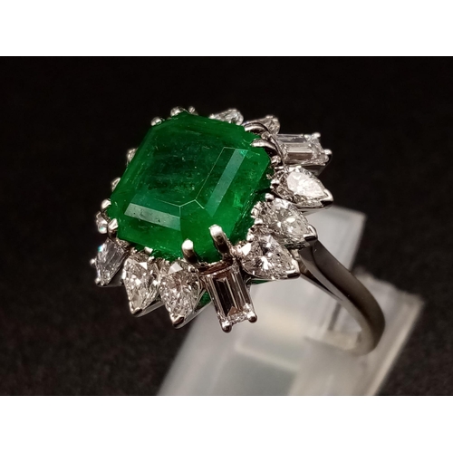 57 - A GIA Certified 18K White Gold Emerald and Diamond Ring. 4.35ct central octagonal-cut emerald surrou... 