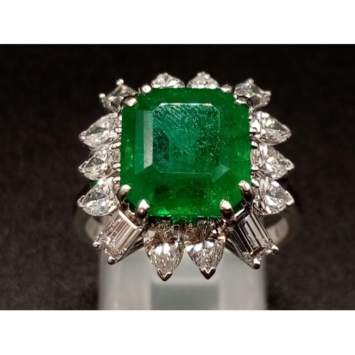 57 - A GIA Certified 18K White Gold Emerald and Diamond Ring. 4.35ct central octagonal-cut emerald surrou... 