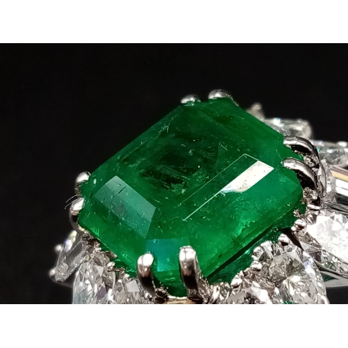 57 - A GIA Certified 18K White Gold Emerald and Diamond Ring. 4.35ct central octagonal-cut emerald surrou... 