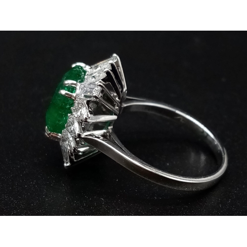 57 - A GIA Certified 18K White Gold Emerald and Diamond Ring. 4.35ct central octagonal-cut emerald surrou... 