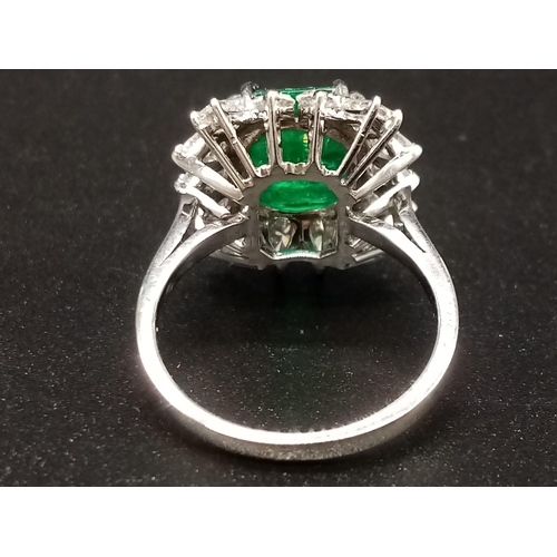 57 - A GIA Certified 18K White Gold Emerald and Diamond Ring. 4.35ct central octagonal-cut emerald surrou... 