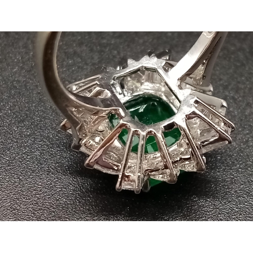 57 - A GIA Certified 18K White Gold Emerald and Diamond Ring. 4.35ct central octagonal-cut emerald surrou... 