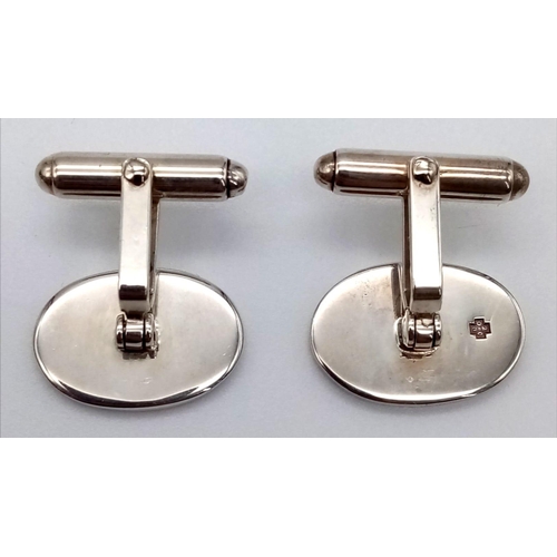 208 - A pair of Mappin and Webb sterling silver cufflinks in original box. 19mm in width, total weight 10.... 