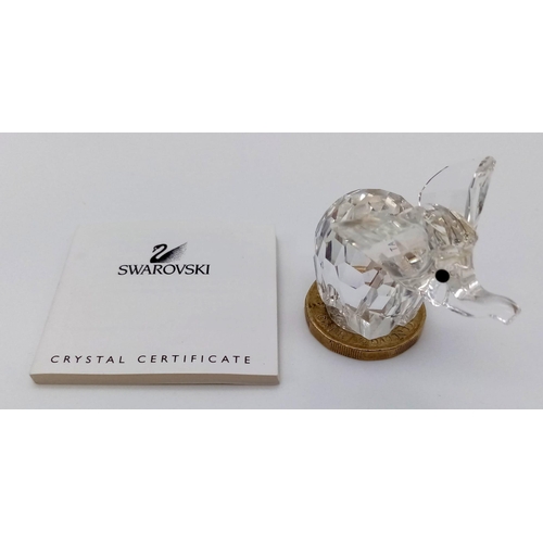 215 - A Swarovski Crystal Elephant, in original box. Stands 35mm tall.