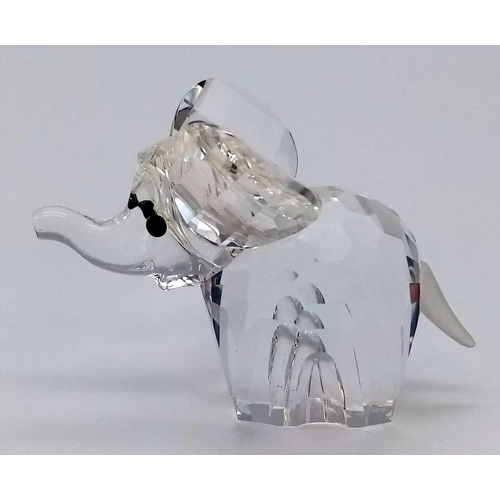 215 - A Swarovski Crystal Elephant, in original box. Stands 35mm tall.