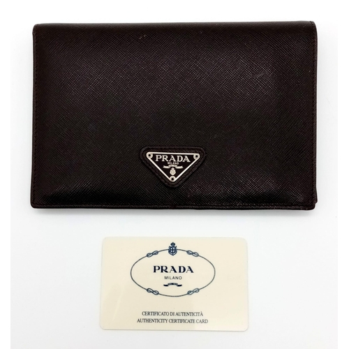 80 - A Gents Large Leather Prada Wallet with Authenticity Card. 16.5 x 11cm. In very good condition.