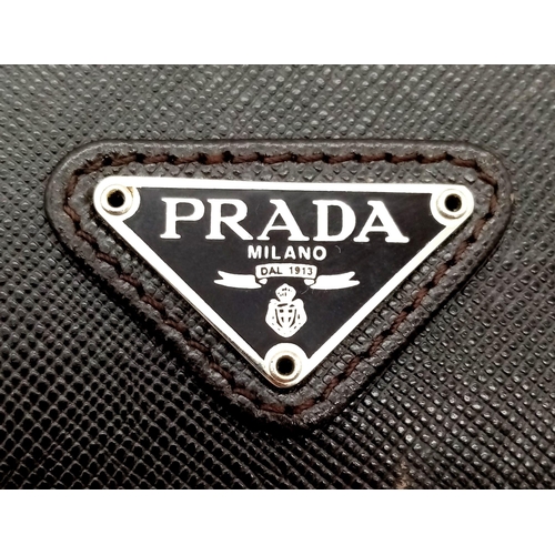 80 - A Gents Large Leather Prada Wallet with Authenticity Card. 16.5 x 11cm. In very good condition.