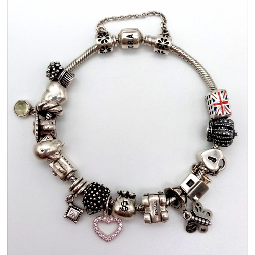 388 - A Pandora Silver Rope Charm Bracelet - 18 charms including: Heart, dolphin handbag, car, hedgehog, l... 