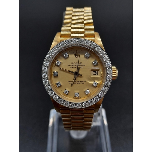 87 - An 18K Gold and Diamond Rolex Oyster Perpetual Datejust Ladies Watch. 18k gold strap and case - 26mm... 