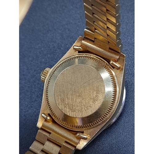 87 - An 18K Gold and Diamond Rolex Oyster Perpetual Datejust Ladies Watch. 18k gold strap and case - 26mm... 