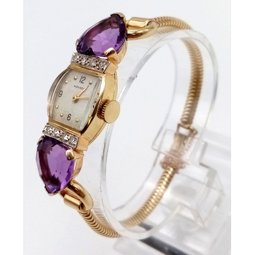 382 - A Vintage Movado 14k Gold Amethyst and Diamond Ladies Watch. 14k gold bracelet with two amethyst hea... 