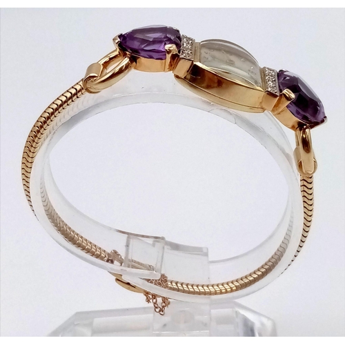 382 - A Vintage Movado 14k Gold Amethyst and Diamond Ladies Watch. 14k gold bracelet with two amethyst hea... 