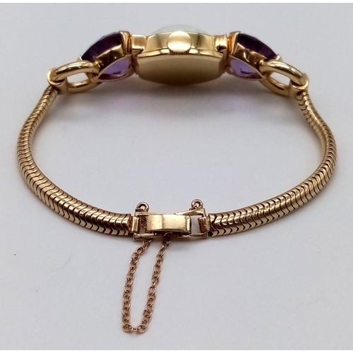 382 - A Vintage Movado 14k Gold Amethyst and Diamond Ladies Watch. 14k gold bracelet with two amethyst hea... 