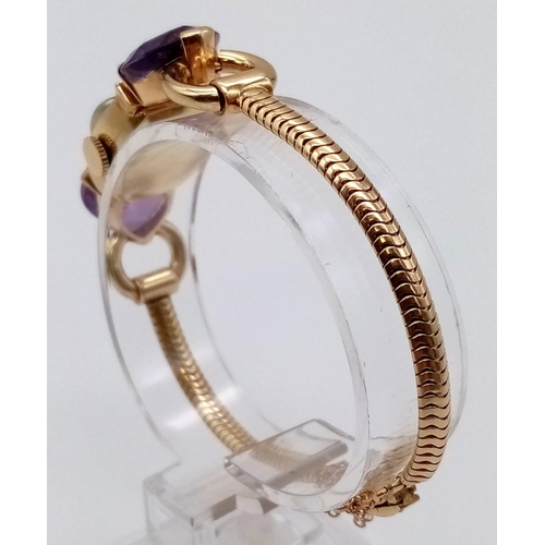 382 - A Vintage Movado 14k Gold Amethyst and Diamond Ladies Watch. 14k gold bracelet with two amethyst hea... 