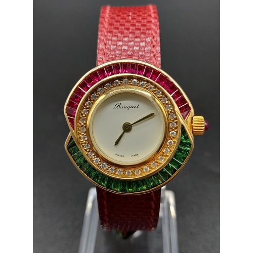 149 - A Bouquet 18K Gold, Ruby and Emerald Dress Watch. Red leather strap. Gold, emerald and ruby case - 3... 