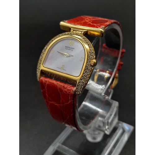 283 - A Sarcar Geneve 18K Gold and Diamond Ladies Watch. Original leather strap with 18k gold hardware. 18... 