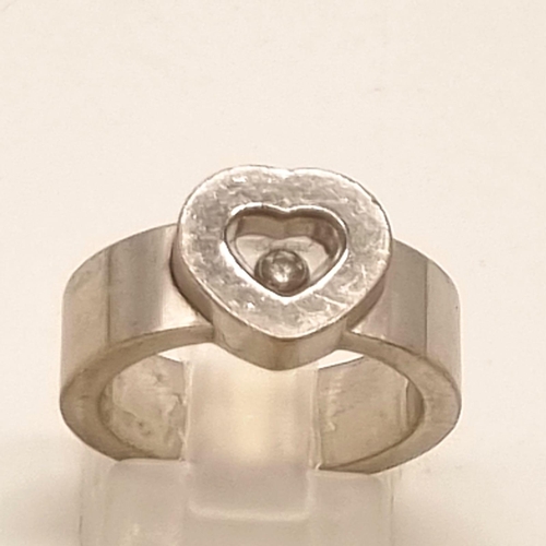 375 - An 18K White Gold Floating Diamond Heart Ring. Central heart encapsulating a floating diamond. Size ... 