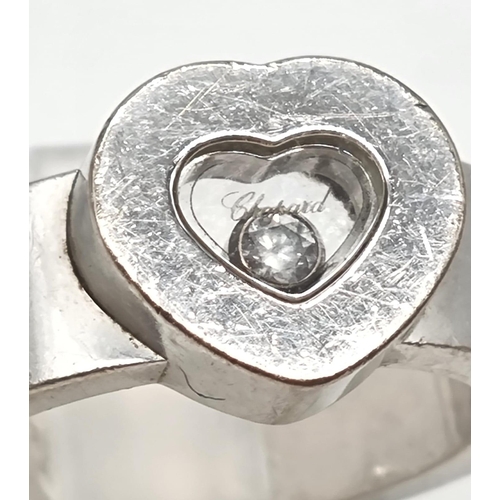 375 - An 18K White Gold Floating Diamond Heart Ring. Central heart encapsulating a floating diamond. Size ... 