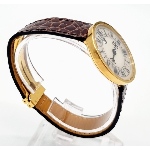 472 - An 18K Gold Hour Window and Elaborate Minute Pointer Watch. Leather and 18k gold strap. 18k gold cas... 