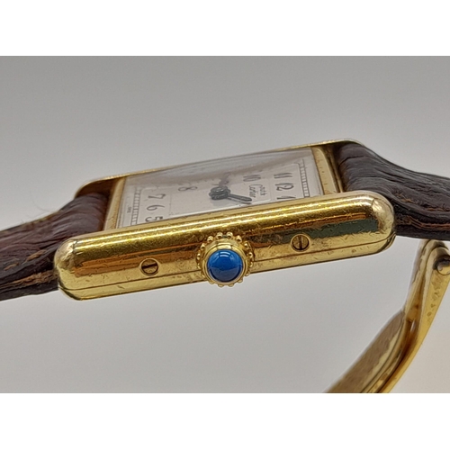 474 - An 18K Gold Must de Cartier Ladies Tank Watch. Brown leather strap and gold buckle. 18k gold case - ... 