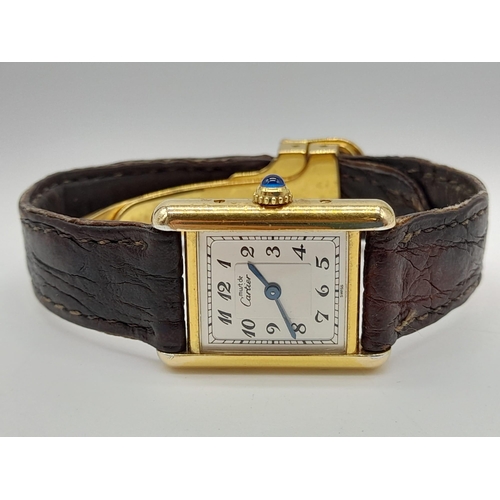 474 - An 18K Gold Must de Cartier Ladies Tank Watch. Brown leather strap and gold buckle. 18k gold case - ... 